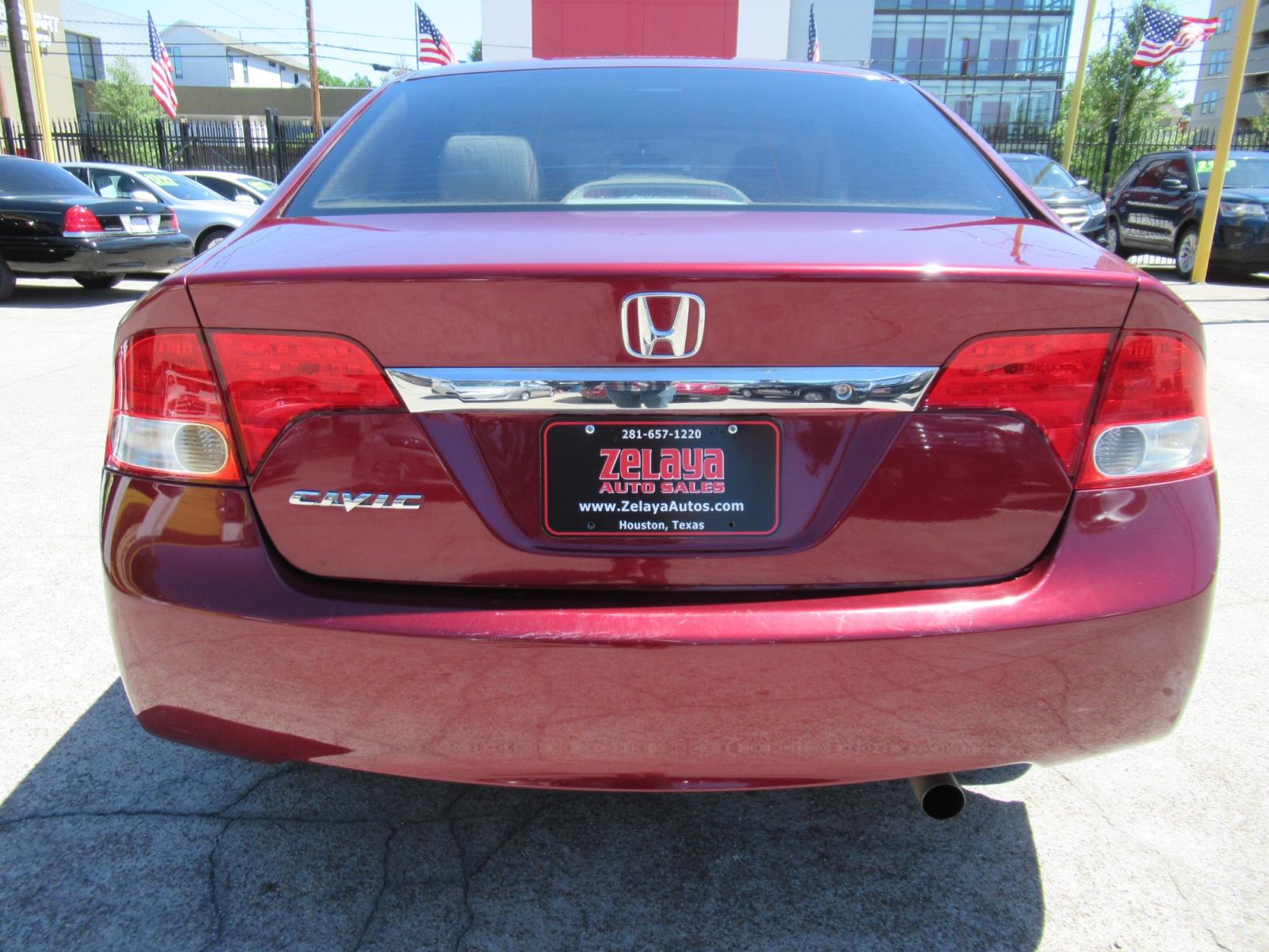 2009 Red /Tan Honda Civic LX Sedan AT (19XFA16529E) with an 1.8L L4 SOHC 16V engine, Automatic Overdrive transmission, located at 1511 North Shepherd Dr., Houston, TX, 77008, (281) 657-1221, 29.798361, -95.412560 - 2009 HONDA CIVIC LX VIN: 19XFA16529E042917 1 9 X F A 1 6 5 2 9 E 0 4 2 9 1 7 SEDAN 4 DR 1.8L I4 F SOHC 16V GASOLINE FRONT WHEEL DRIVE - Photo #15